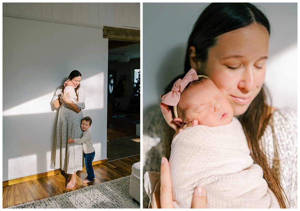 mother standing in sunshine holding her newborn in her living room