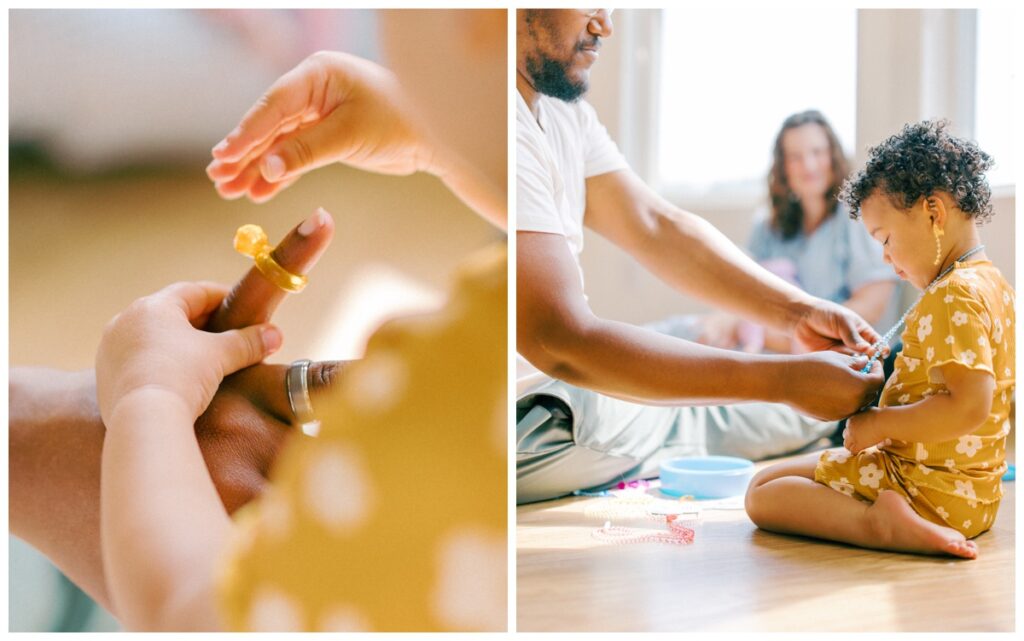 In home newborn session with a toddler while parents cuddle their girls on the couch