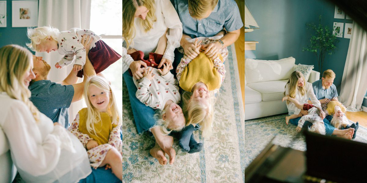 family cuddled up in the living room playing together